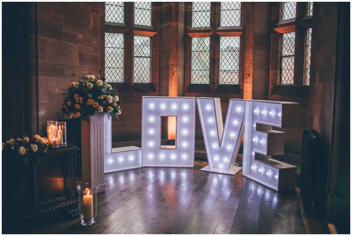 Bang on trend LOVE lights at Peckforton Castle wedding.