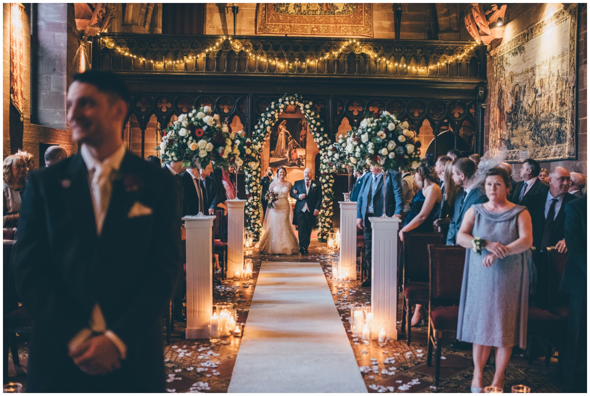 The bride walks down the aisle towards her husband-to-be.