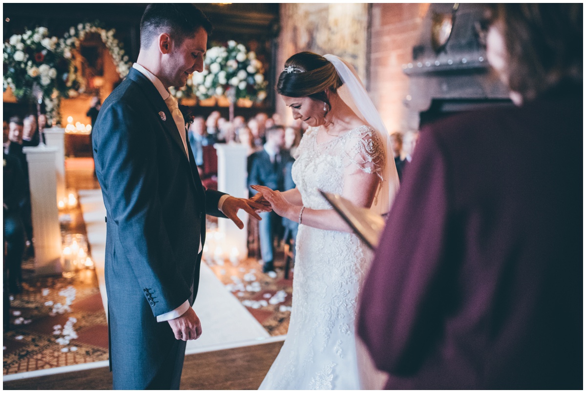 The couple exchange rings during their fairytale wedding.
