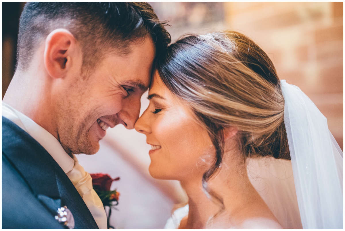 New husband and wife share an intimate moment.