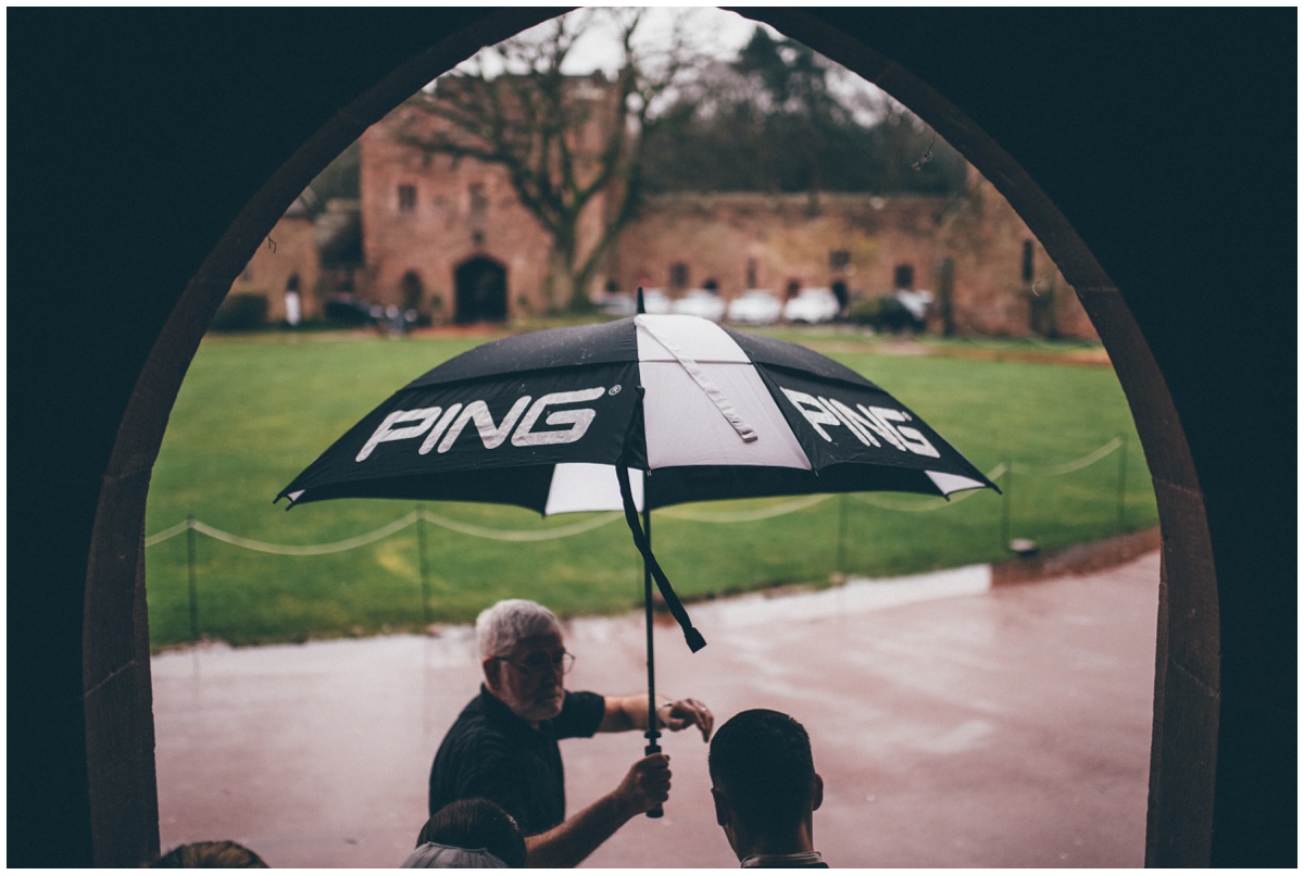 The rain wouldn't stop the newlyweds at Peckforton Castle.