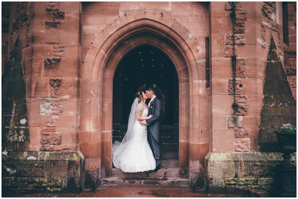 Beautiful and simple wedding photograph at Peckforton Castle entrance.