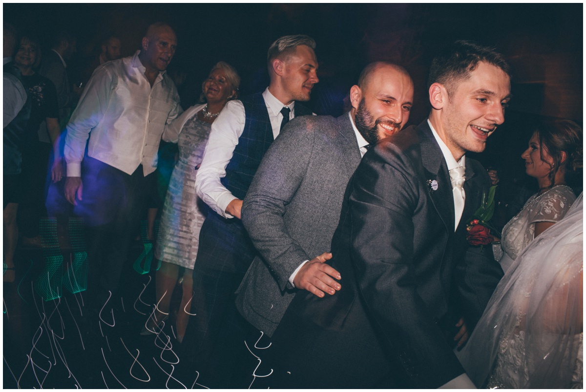 Guests dance the night away at Peckforton Castle wedding.
