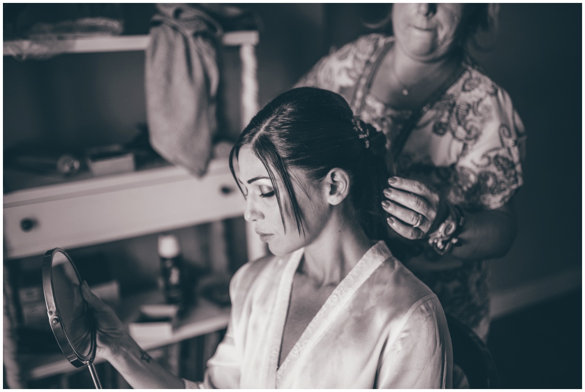 Italian bride getting her hair done on her wedding morning.