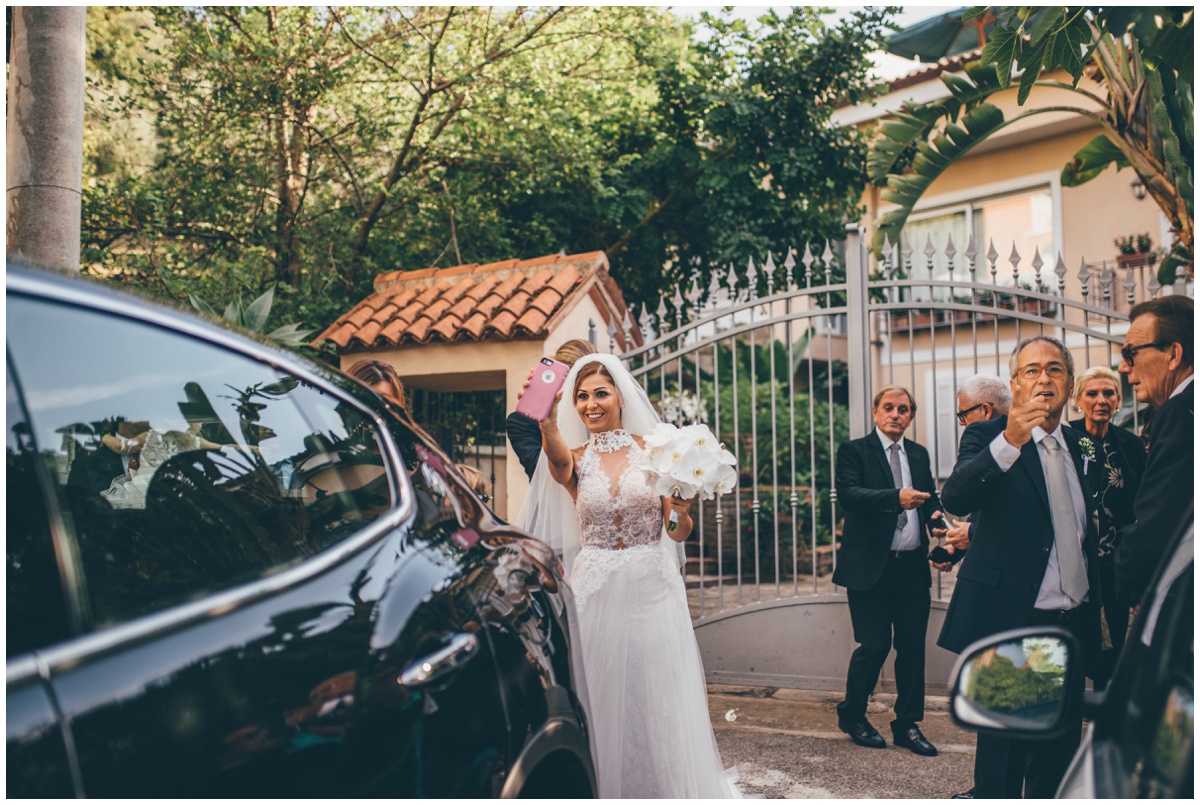 Beautiful Italian bride takes a selfie on her wedding day.