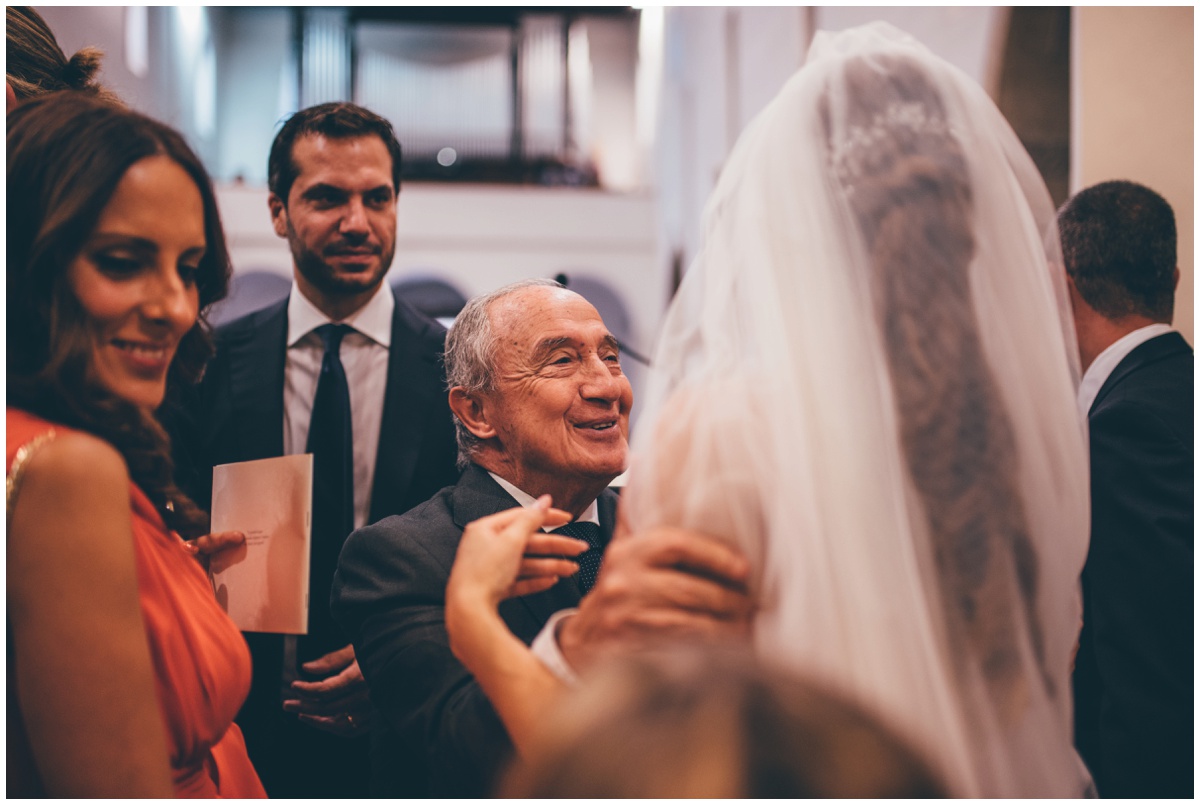 Beautiful bride greets her older wedding guest.
