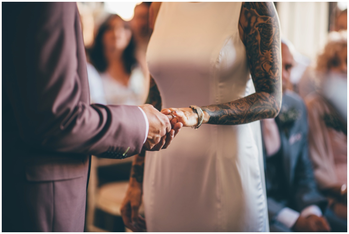 Bride and Groom exchange wedding rings in Oddfellows wedding.