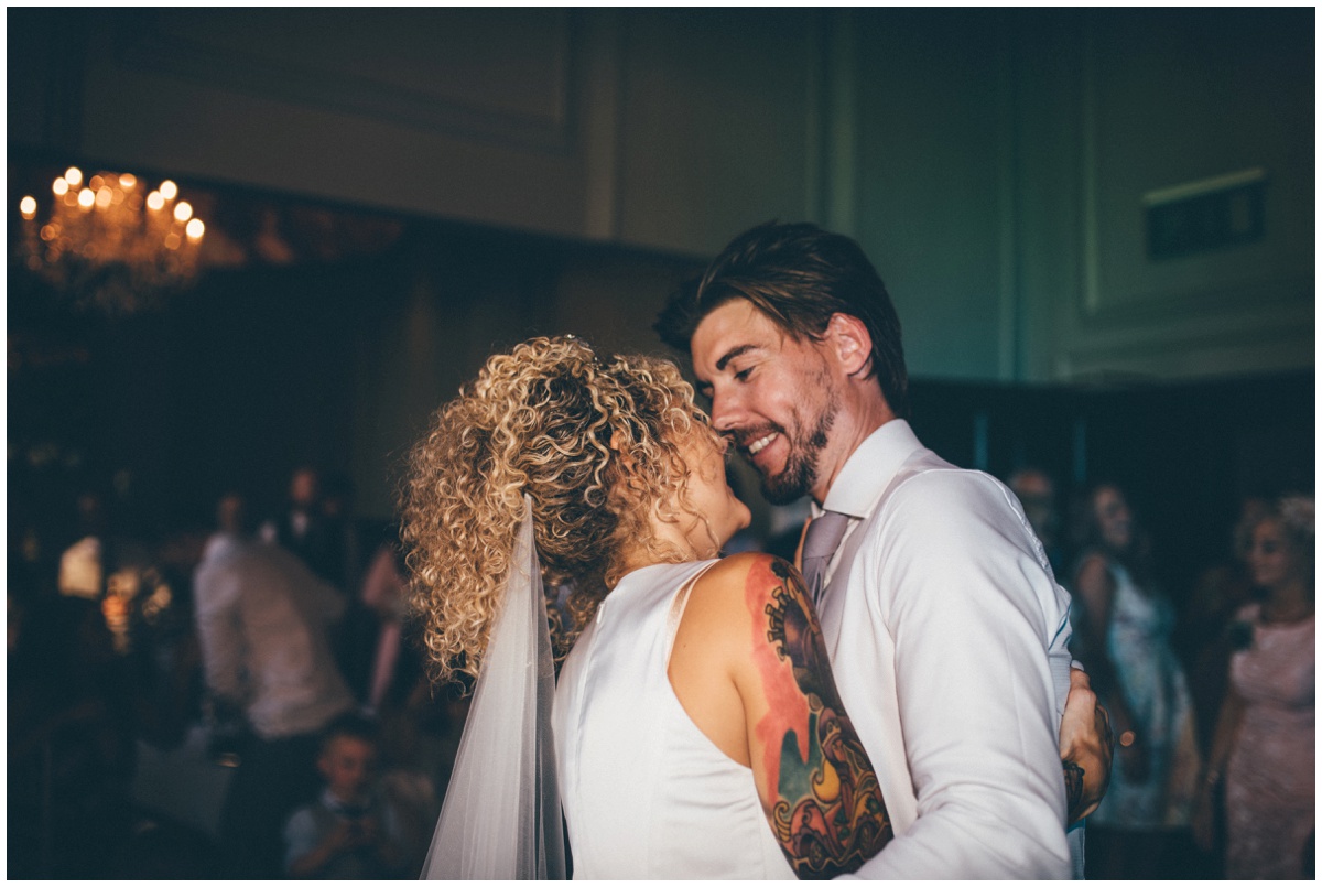 Tattooed bride and groom in pink suit do their First Dance in Oddfellows, Chester.