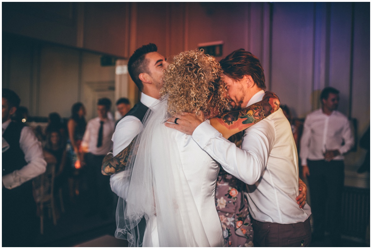 Tattooed bride and groom in pink suit do their First Dance in Oddfellows, Chester.