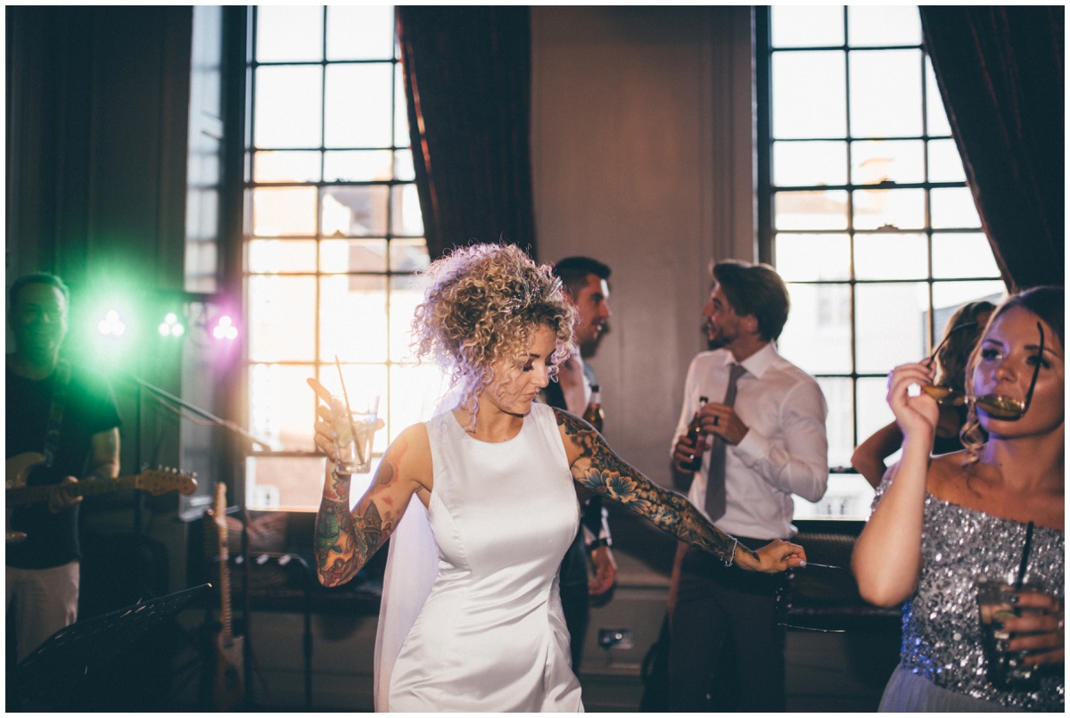 Wedding guests dancing with tattooed bride at Oddfellows city centre wedding.