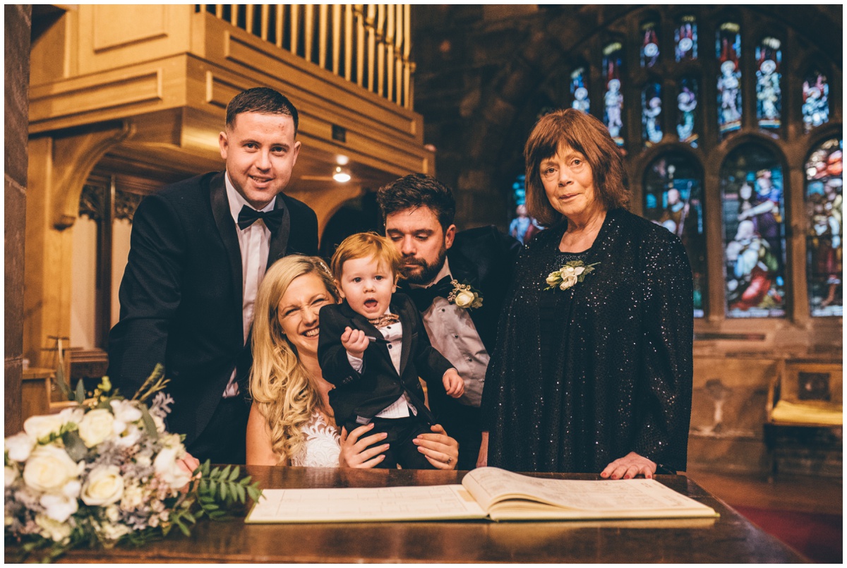 Signing the register at New Years Eve wedding ceremony in Cheshire.