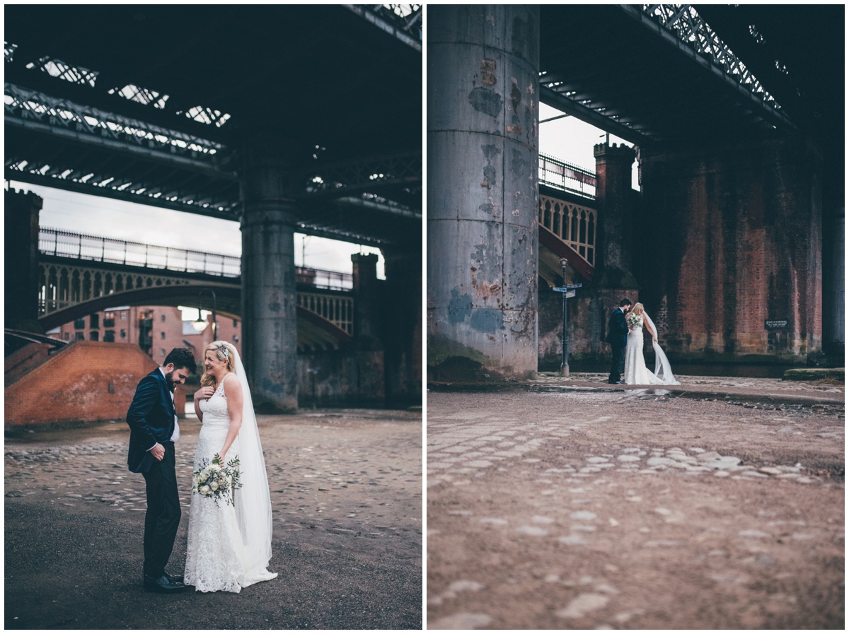 New Years Eve bride and groom pose for their wedding photographs in Castlefield, Manchester.