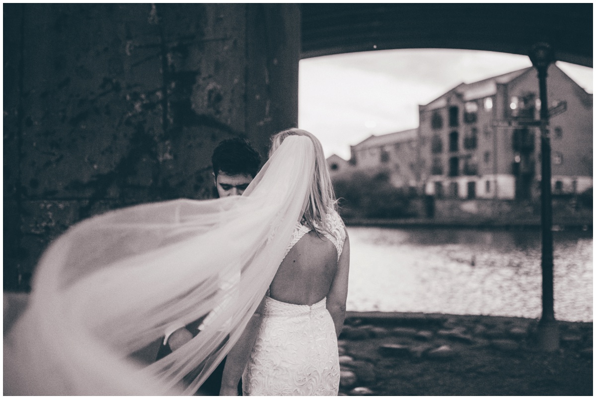 New Years Eve bride and groom pose for their wedding photographs in Castlefield, Manchester City Centre.