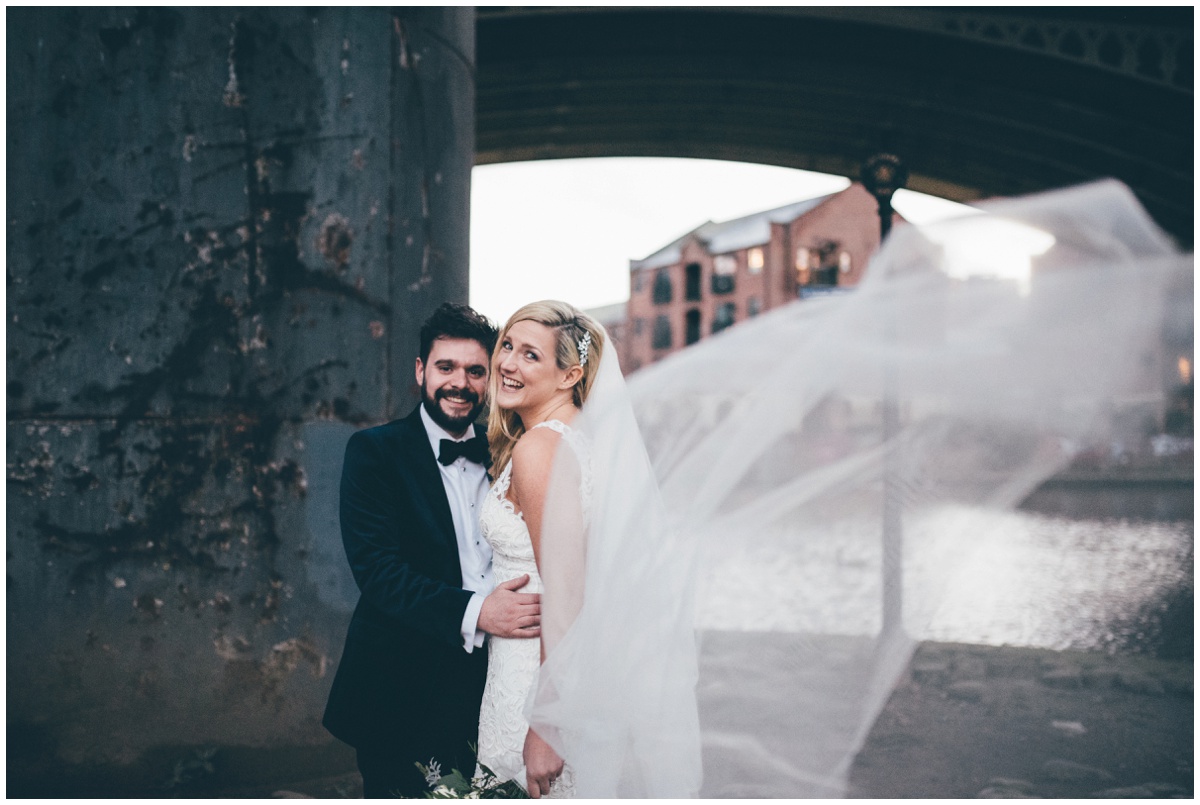 New Years Eve bride and groom pose for their wedding photographs in Castlefield, Manchester City Centre.