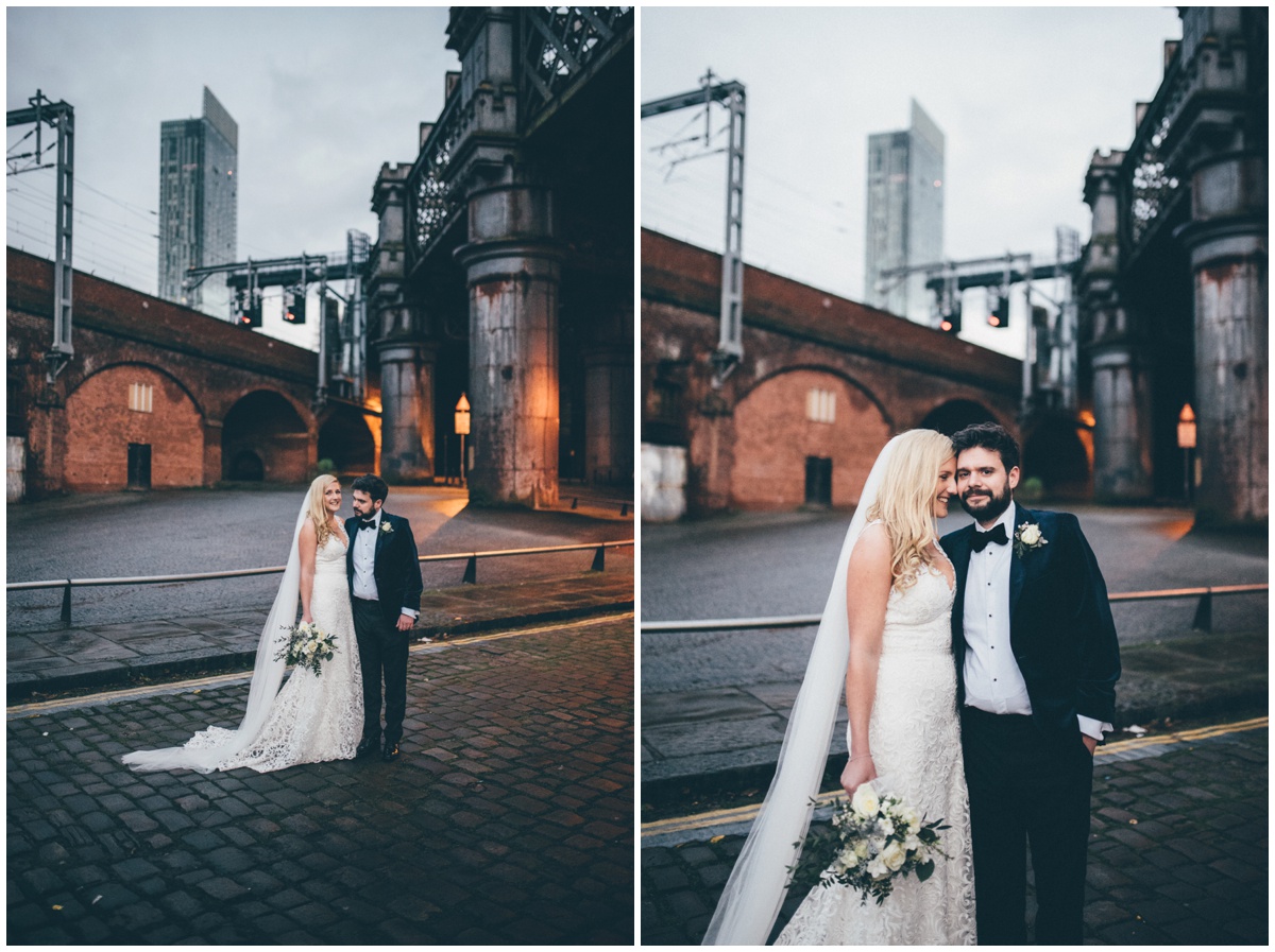 New Years Eve bride and groom pose for their wedding photographs in Castlefield, Manchester City Centre.