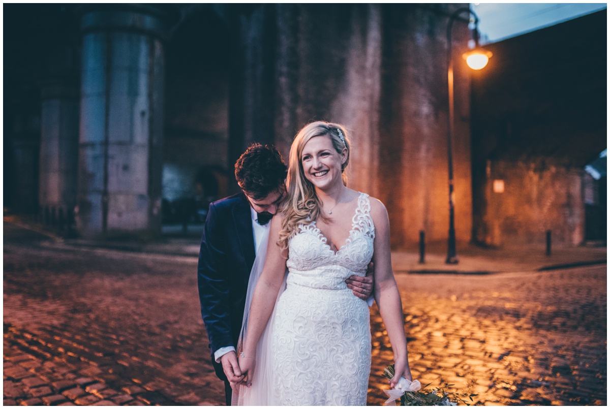 New Years Eve bride and groom pose for their wedding photographs in Castlefield, Manchester City Centre.