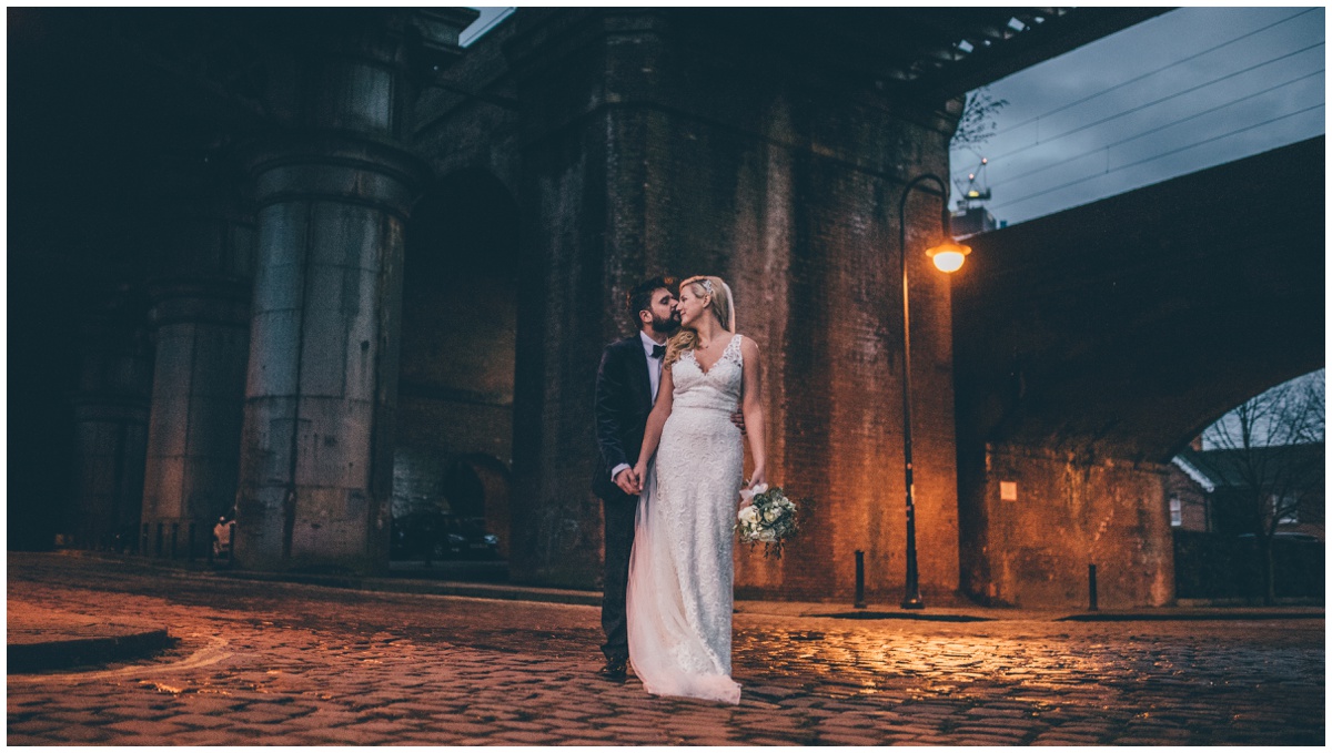 New Years Eve bride and groom pose for their wedding photographs in Castlefield, Manchester City Centre.