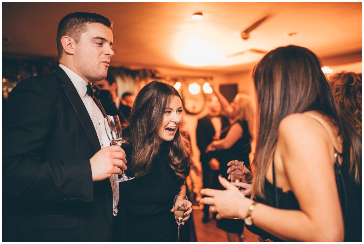 Wedding guests celebrate at New Years Eve wedding at Great John Street Hotel in Manchester.