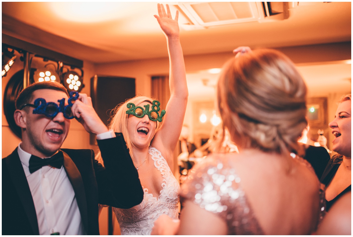 Wedding guests dance at New Years Eve wedding at Great John Street Hotel in Manchester.