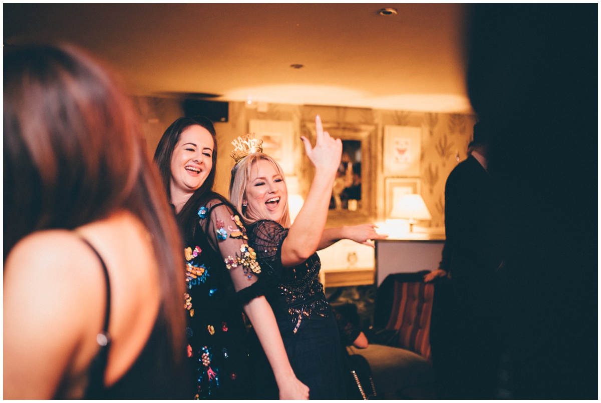 Wedding guests dance at New Years Eve wedding at Great John Street Hotel in Manchester.