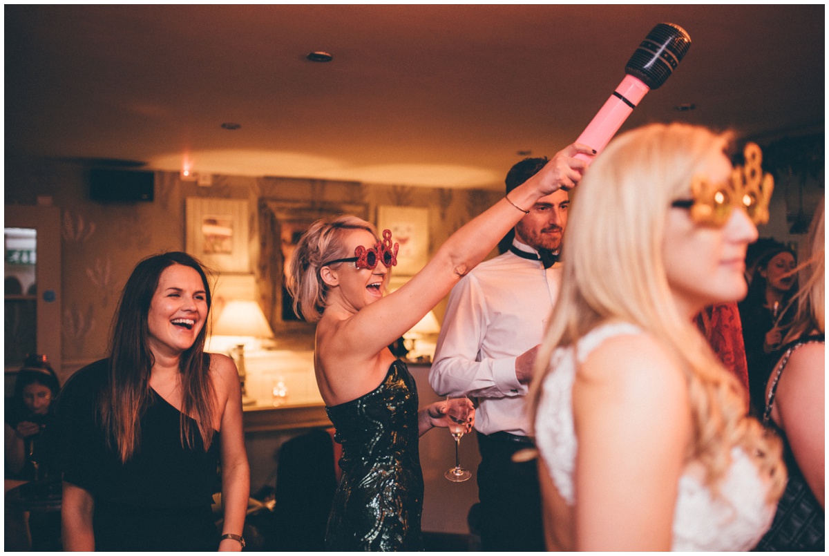 Wedding guests dance at New Years Eve wedding at Great John Street Hotel in Manchester.