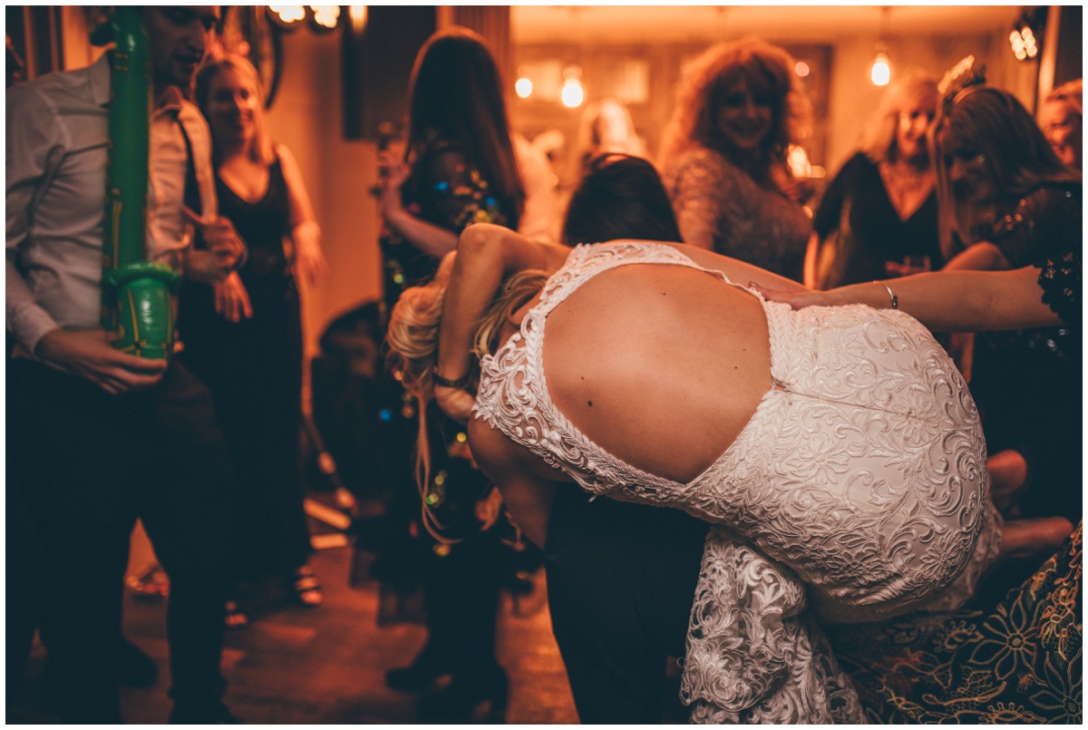 Wedding guests dance at New Years Eve wedding at Great John Street Hotel in Manchester.