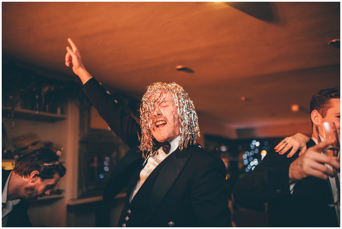 Wedding guests dance at New Years Eve wedding at Great John Street Hotel in Manchester.