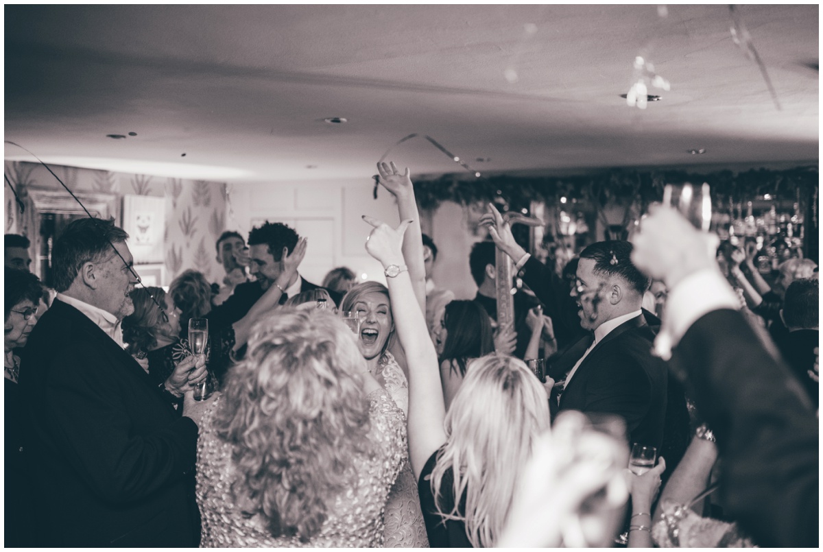 Wedding guests celebrate the New Year at New Years Eve wedding at Great John Street Hotel in Manchester.