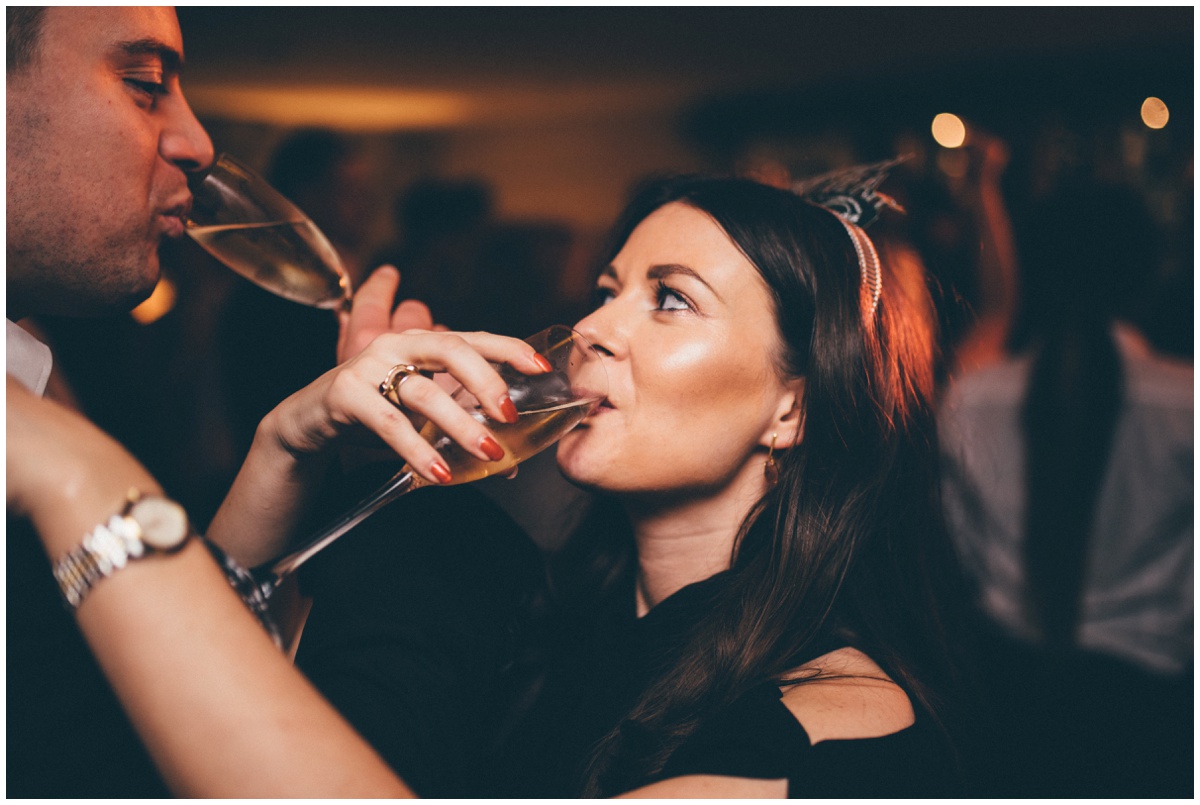 Wedding guests celebrate the New Year at New Years Eve wedding at Great John Street Hotel in Manchester.