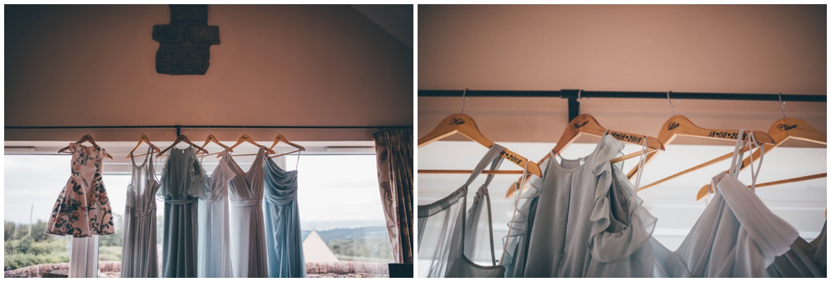 Blue bridesmaid dresses hung up in preparation for the Big Day.
