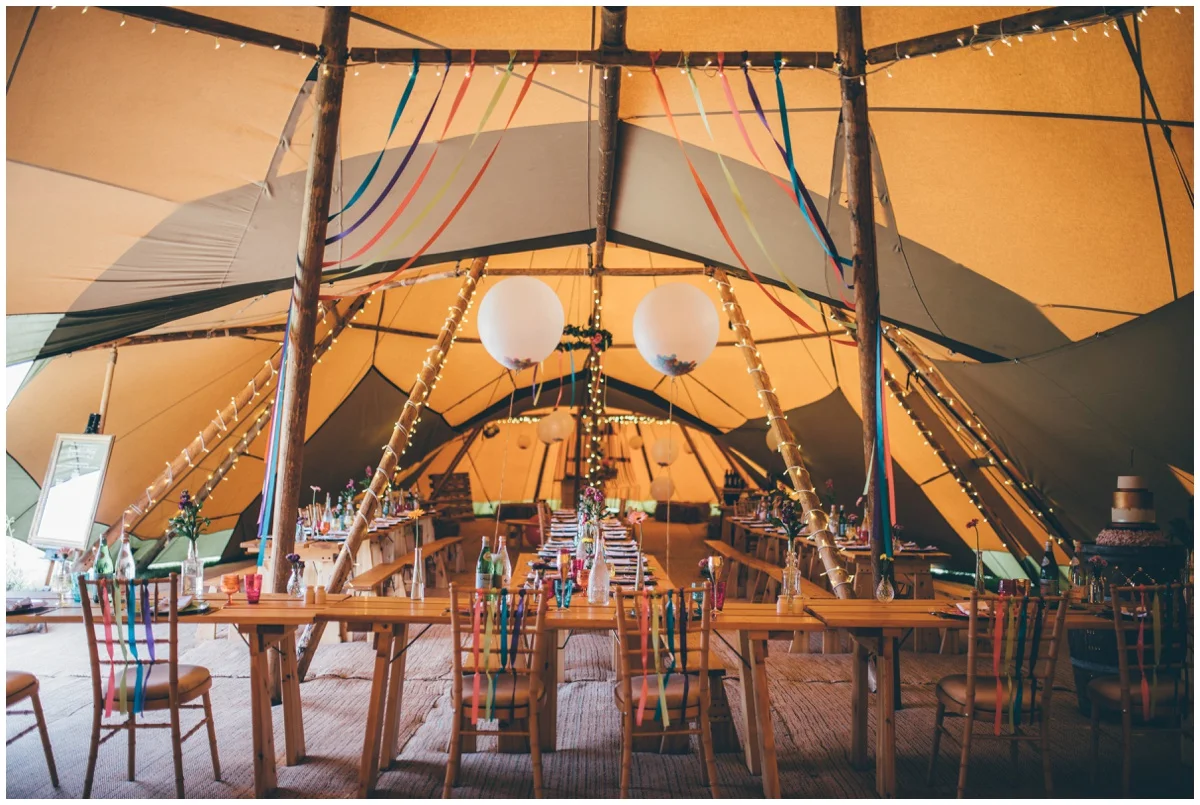 Interior of brightly coloured wedding tipi in Staffordshire.