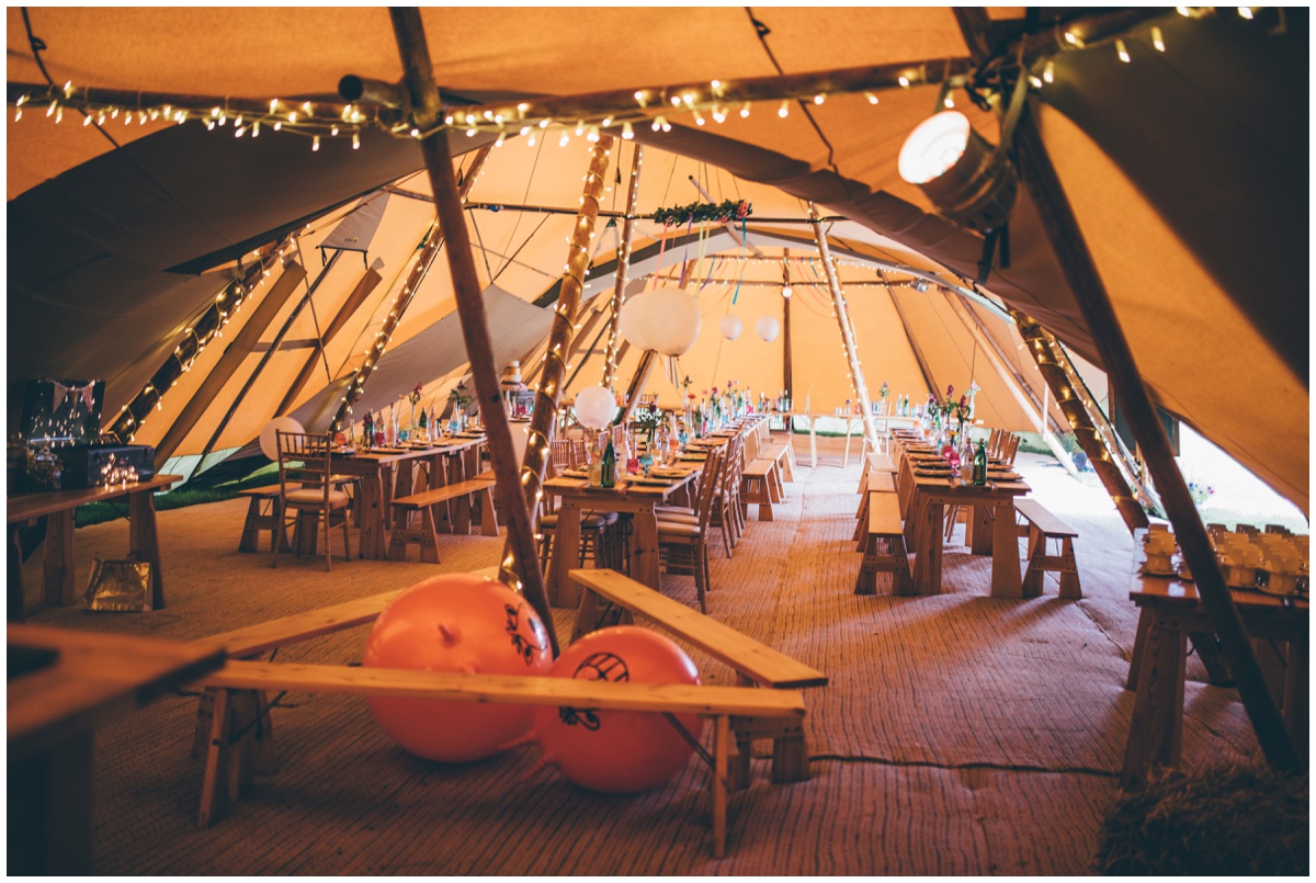 Interior of brightly coloured wedding tipi in Staffordshire.