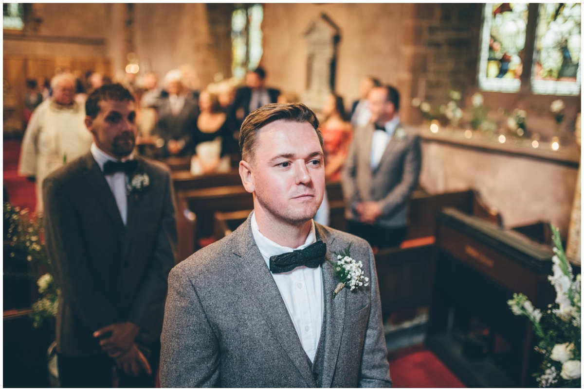 The groom waits for his bride to arrive at St. Matthews church in Leek, Staffordshire.