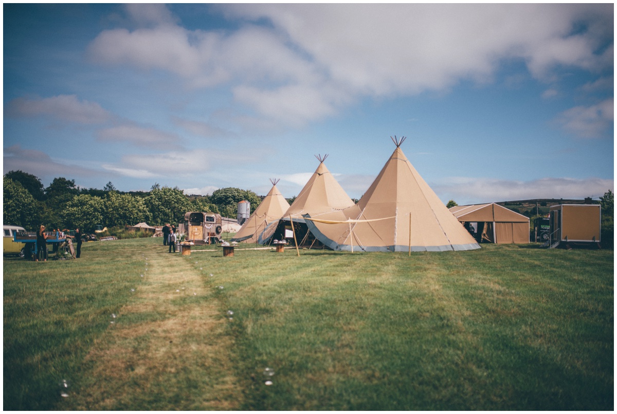 Wedding Tipis in a family field on a beautiful summers day, by Cheshire wedding photographer.