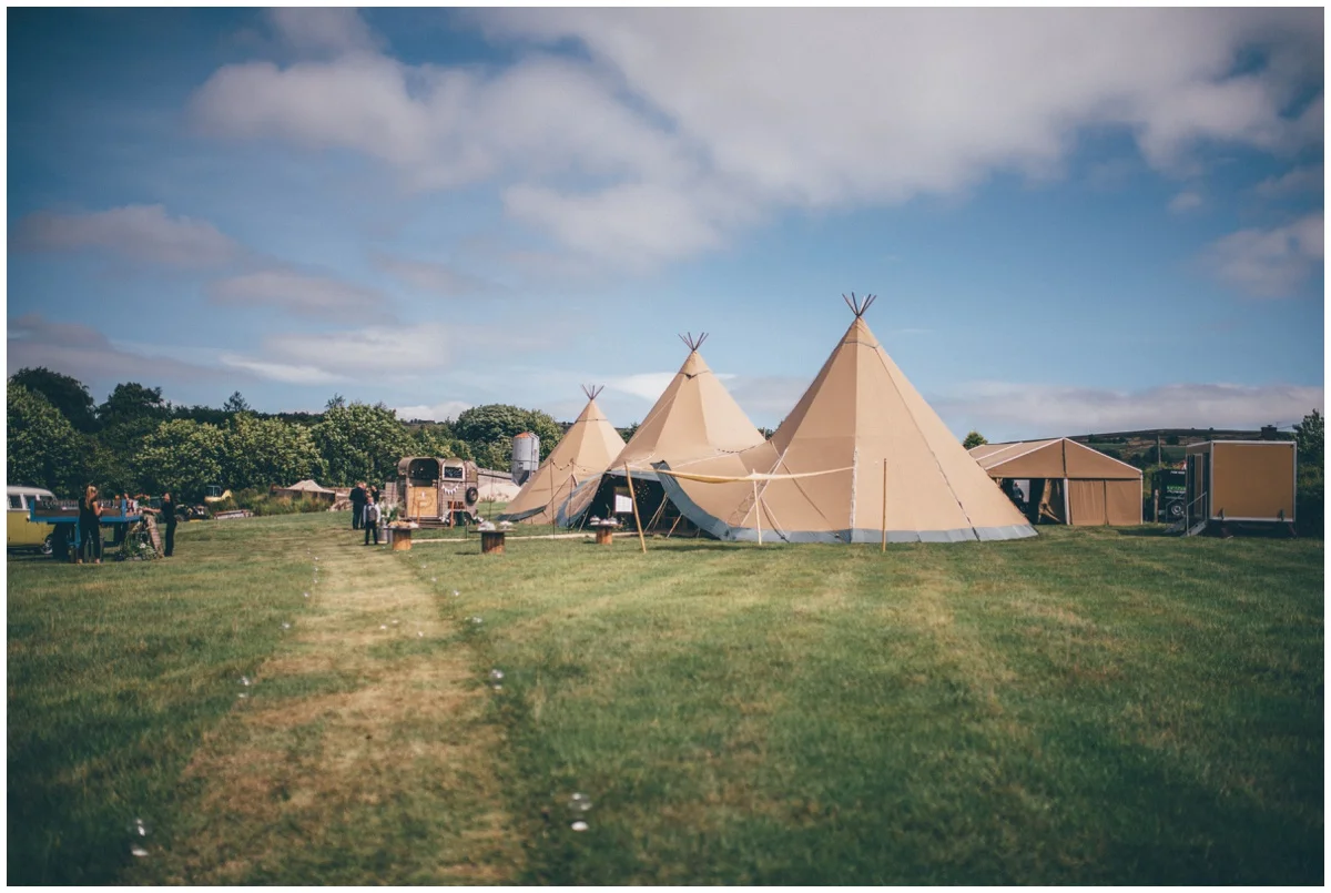 Wedding Tipis in a family field on a beautiful summers day, by Cheshire wedding photographer.