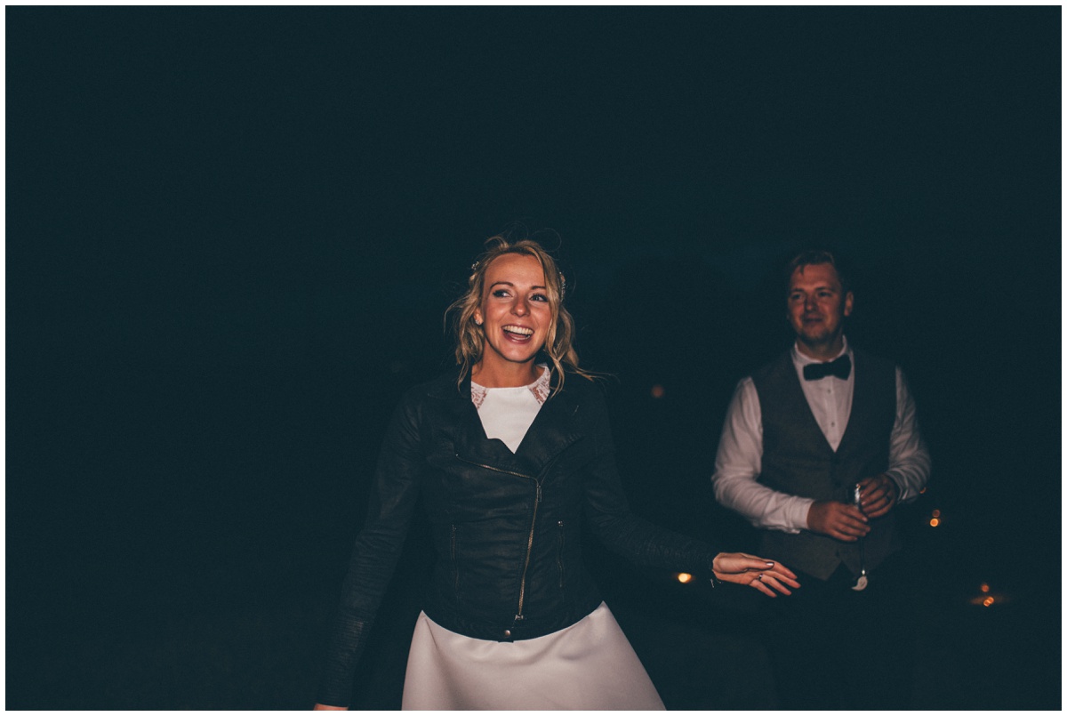 Bride and groom enjoy their evening reception at their tipi wedding in Staffordshire.