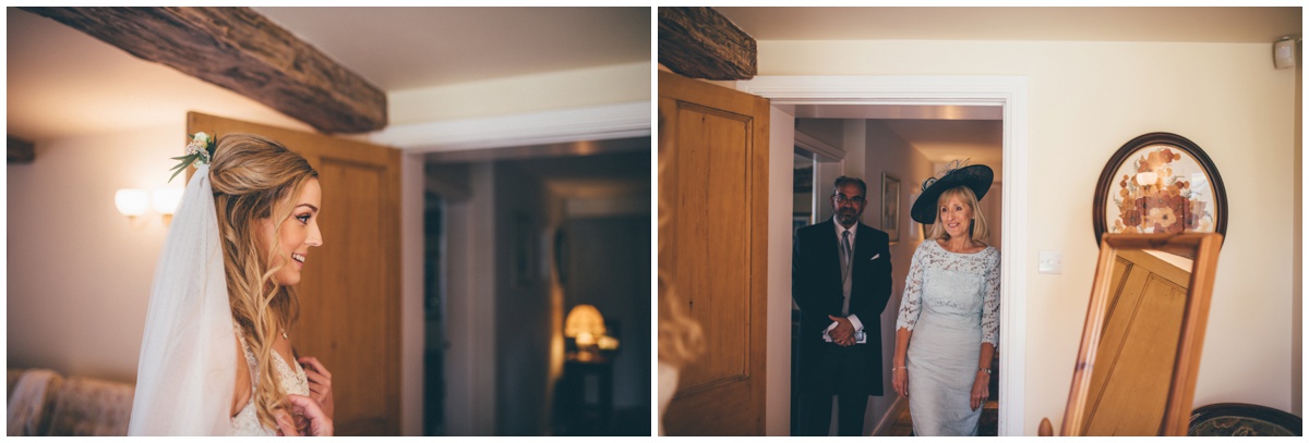 Bride's parents see her dressed and ready for the first time.