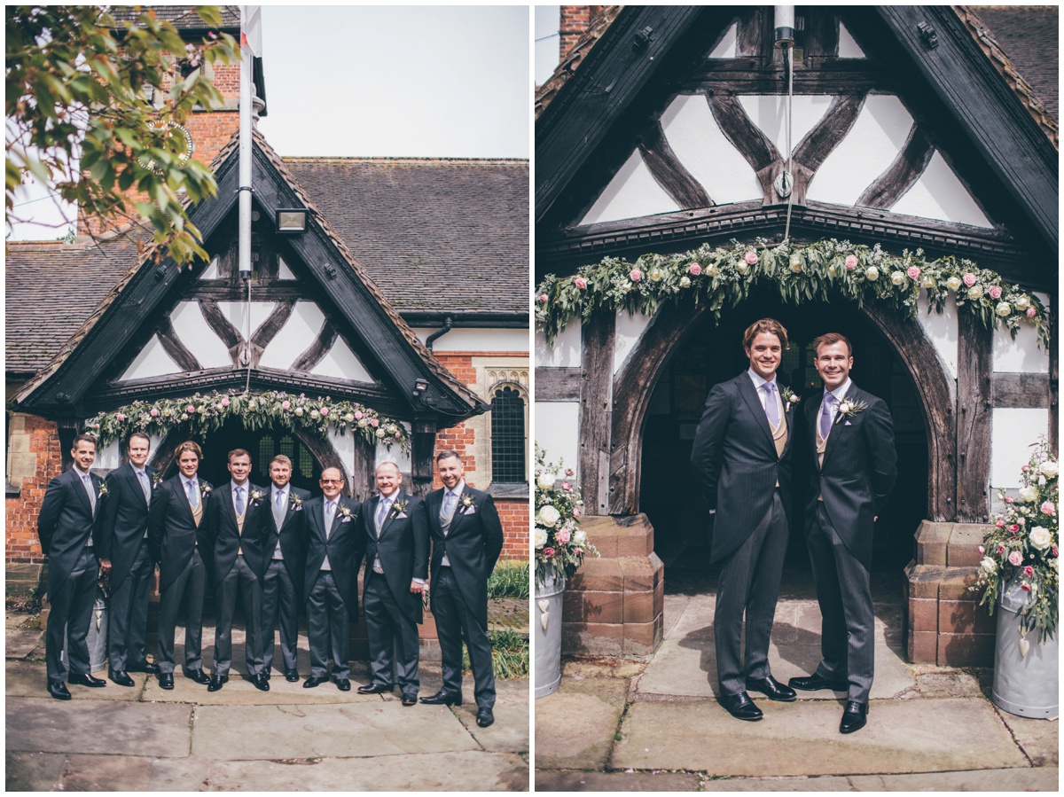 Groom and his groomsmen pose for some photographs outside St Mary's church in Cheshire.