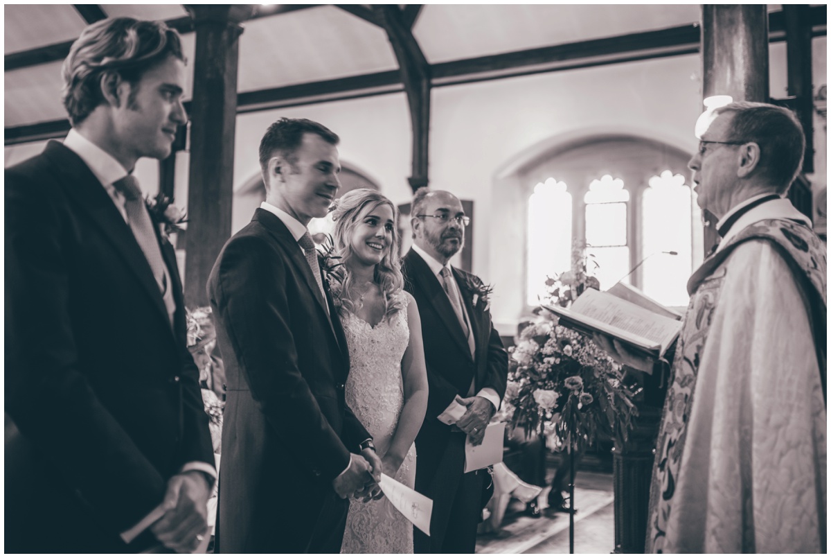 Groom and Best Man wait for the bride to arrive in St Mary's Church in Cheshire.