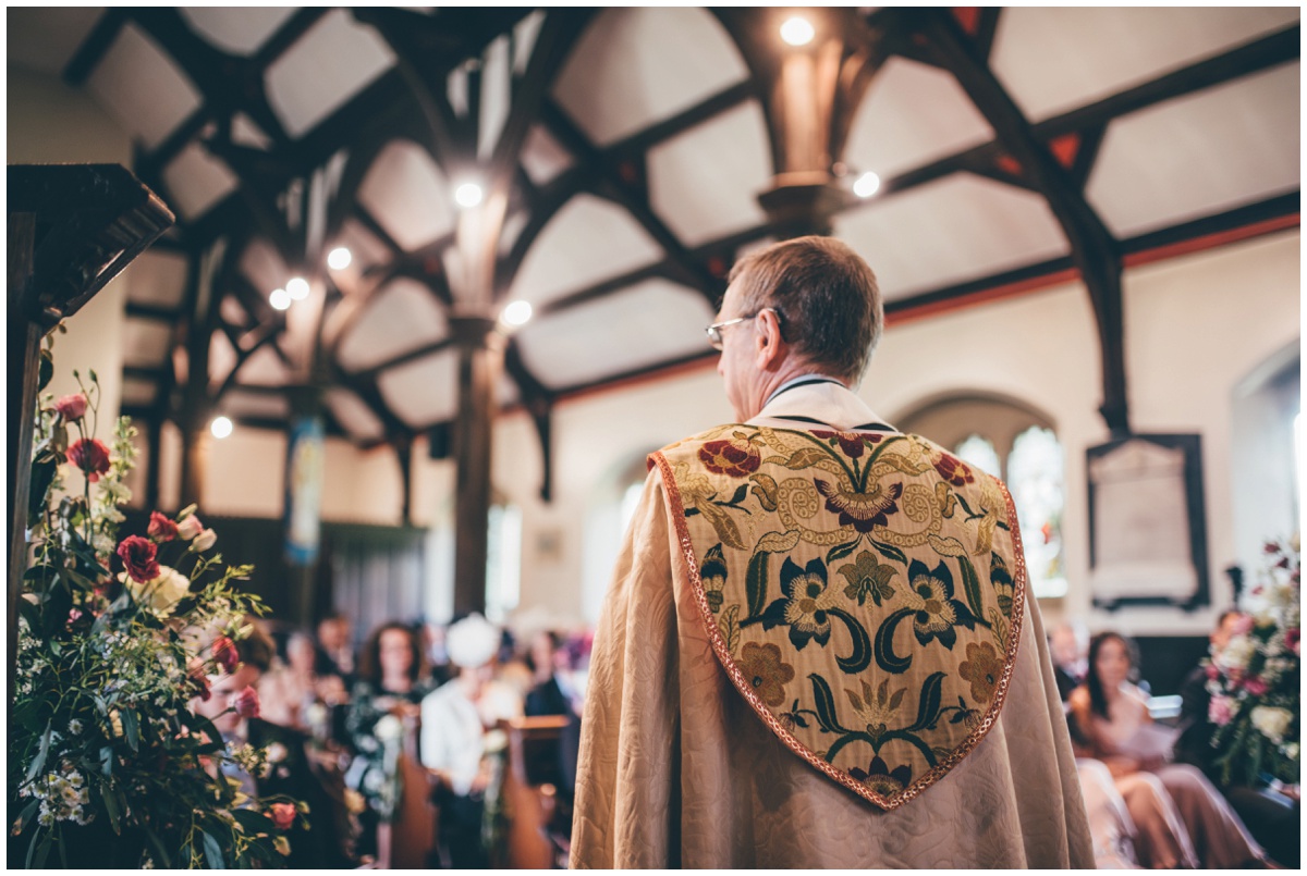 The vicar leads the wedding service in St Marys Church in Cheshire.