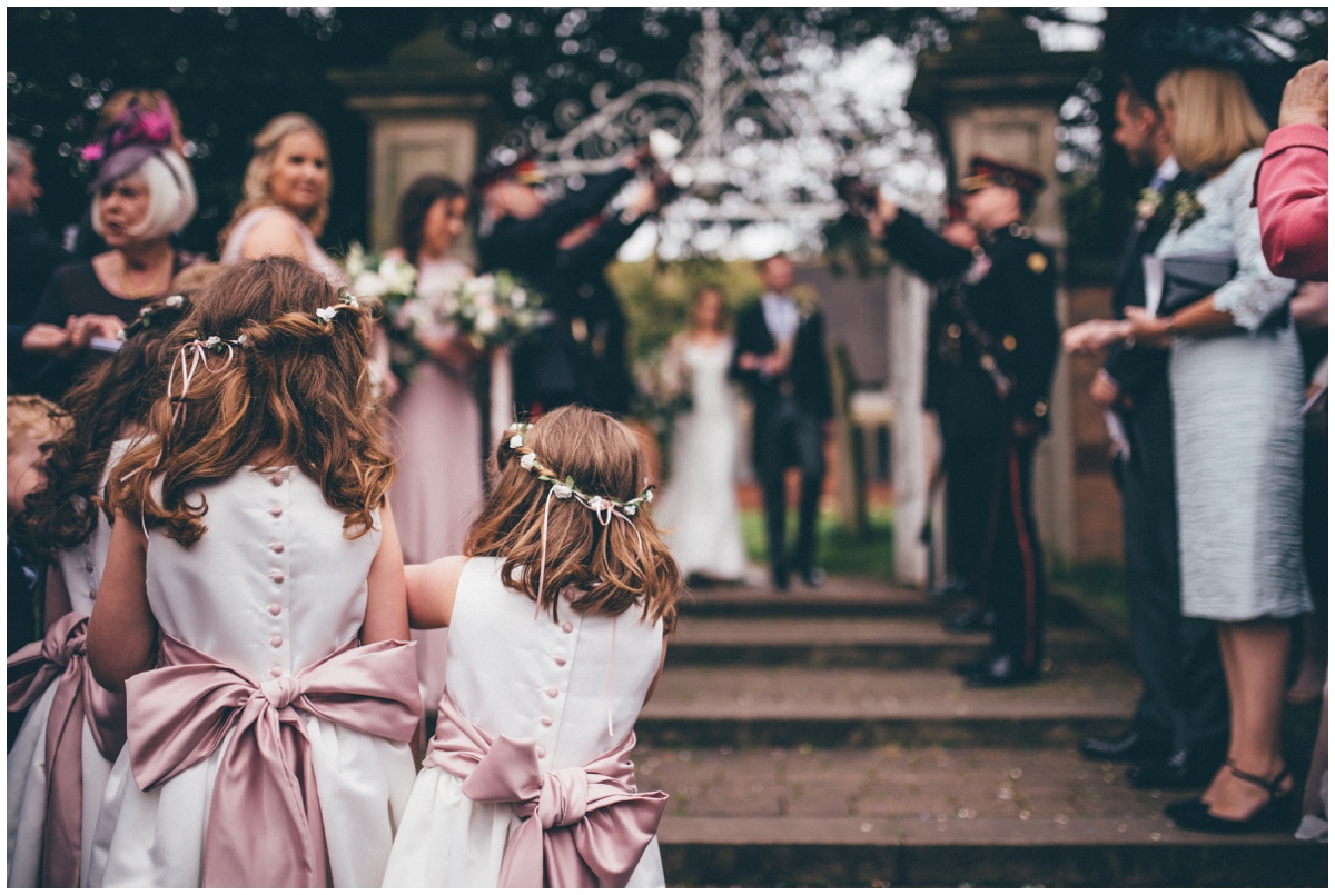 Flowergirls wait to throw confetti at St Mary's Church in Cheshire.