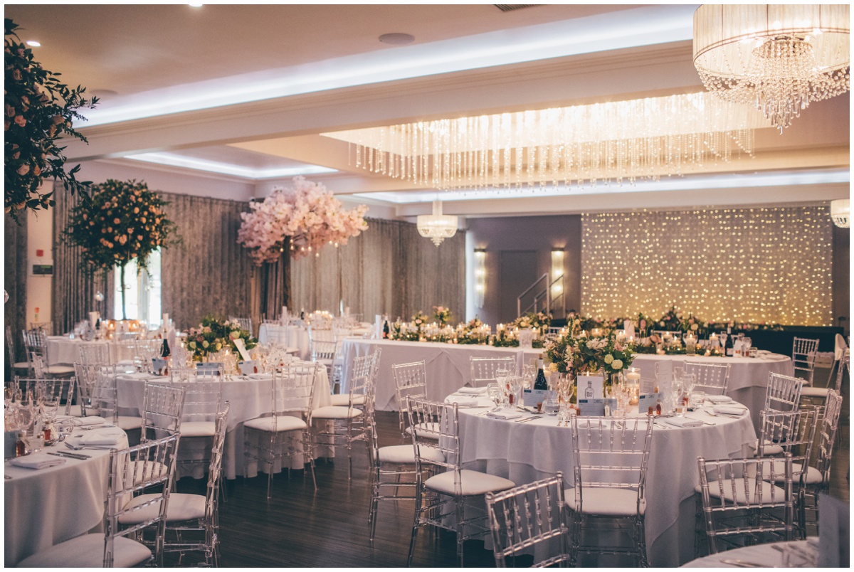 Red floral decorated the wedding venue, Merrydale Manor in pastel flowers and candles.