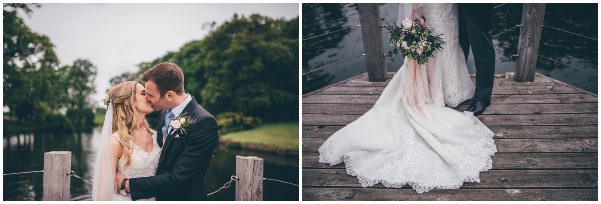 Bride and groom at Merrydale Manor have their wedding photographs taken on the jetty.