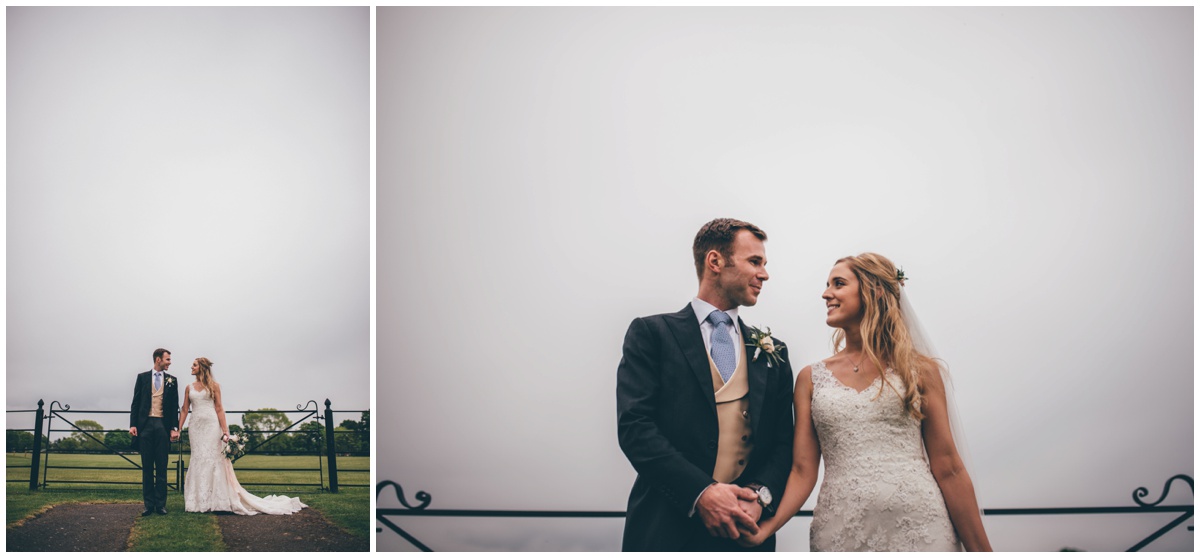 Bride and groom at Merrydale Manor in the grounds during their summer wedding.