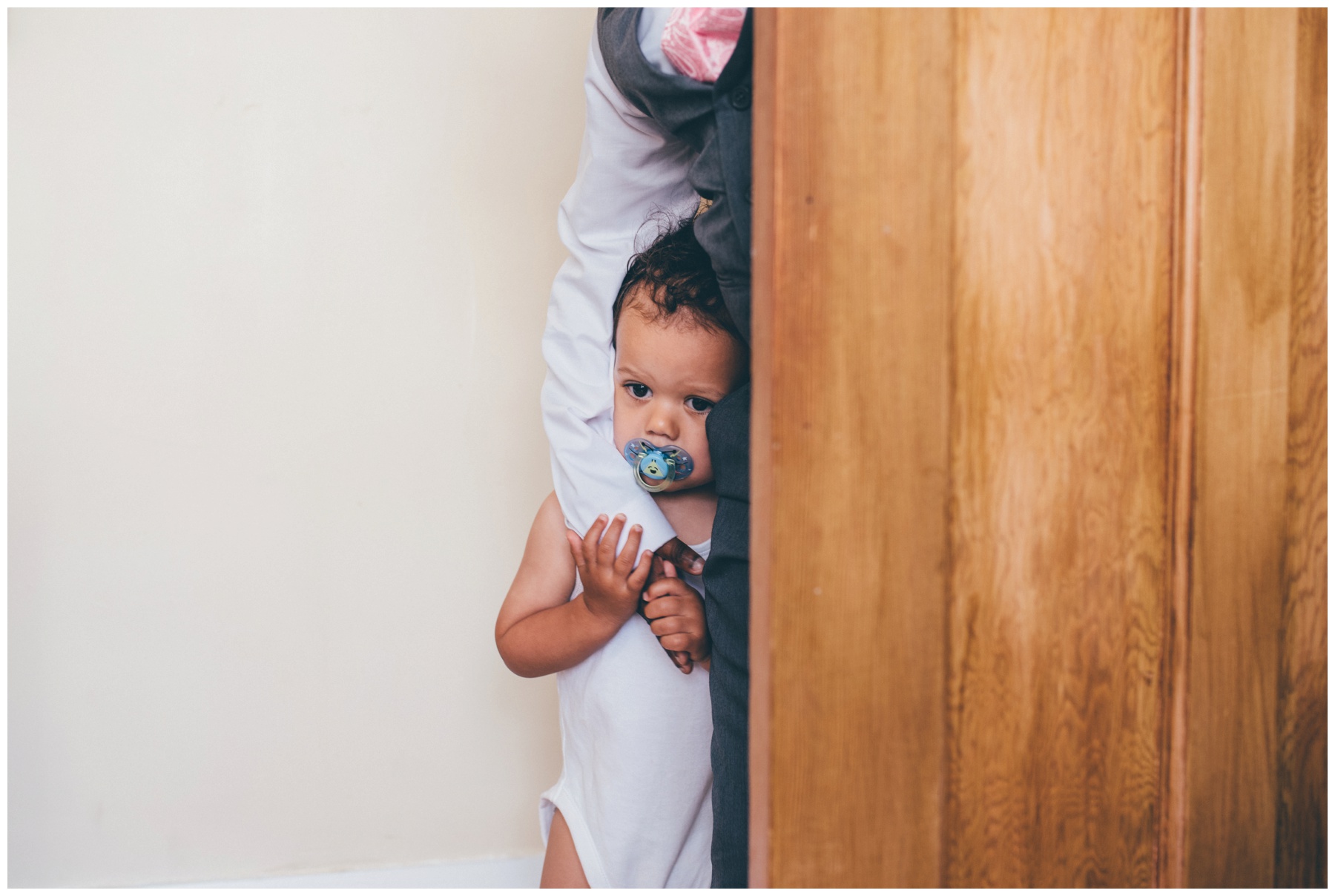 Cute little pageboy wakes up from his nap before his mum and dad's Liverpool wedding.