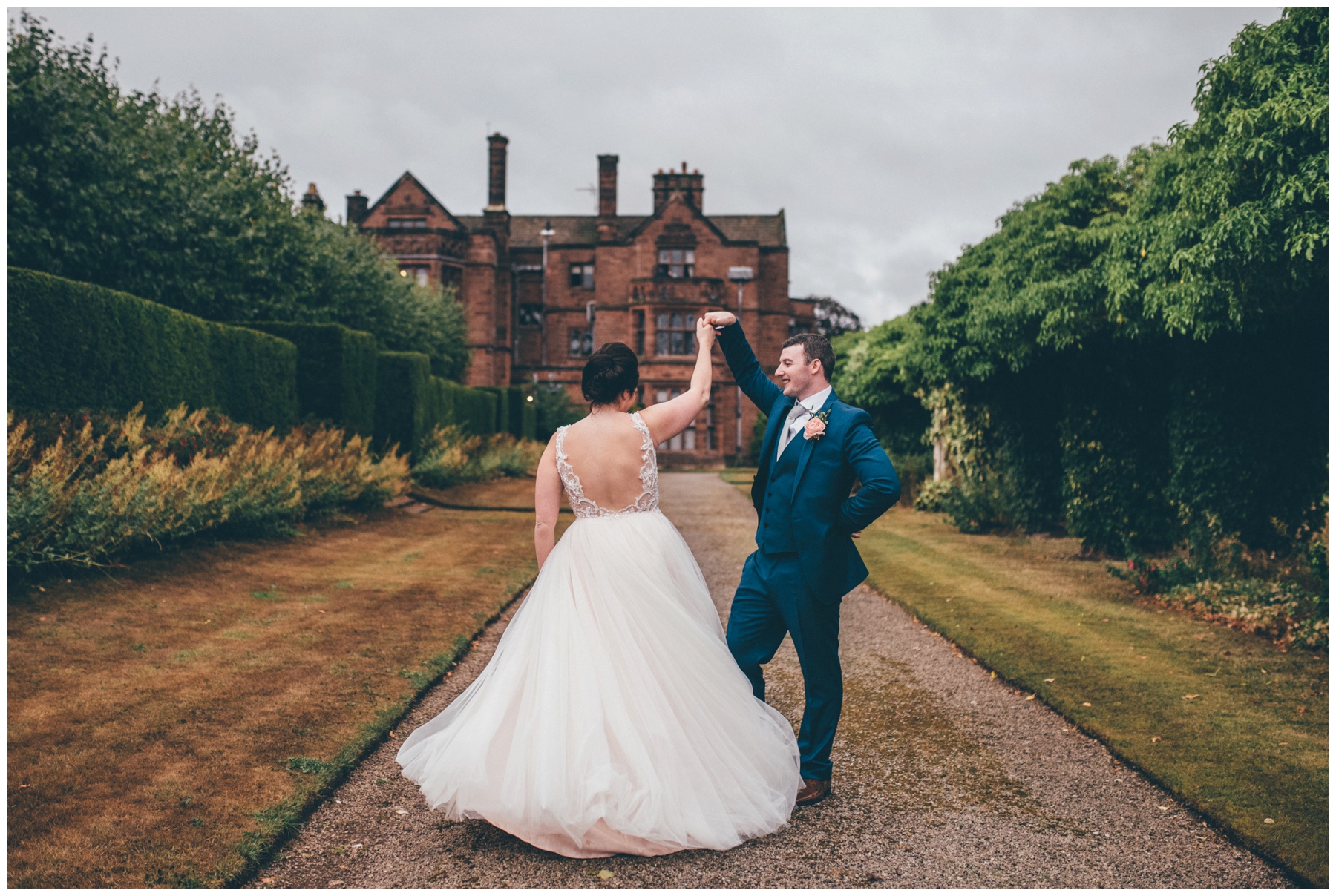 The newlyweds practise their First Dance in the grounds of Thornton Manor at their Wirral Wedding.