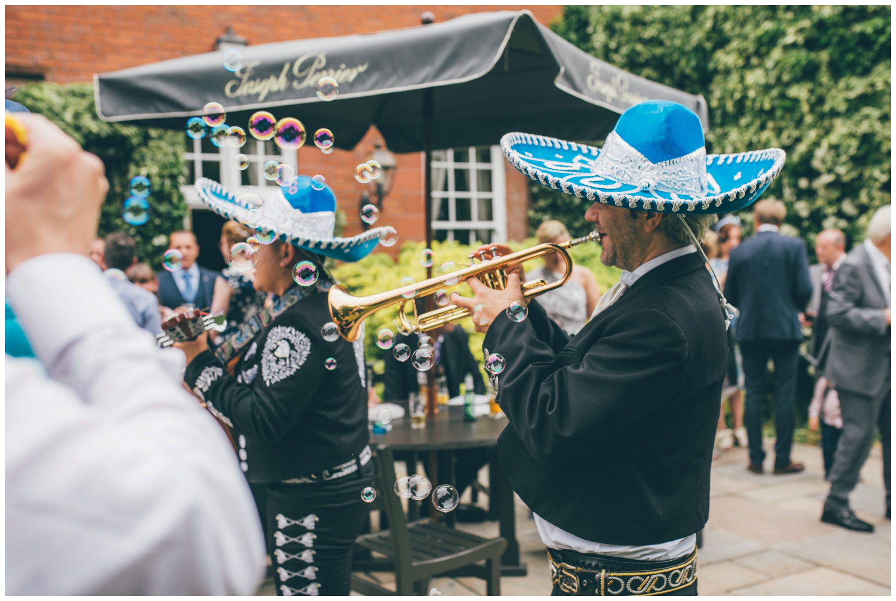 Bride and groom hire a mariachi band for their summer wedding at Nunsmere Hall, in full sombreros.