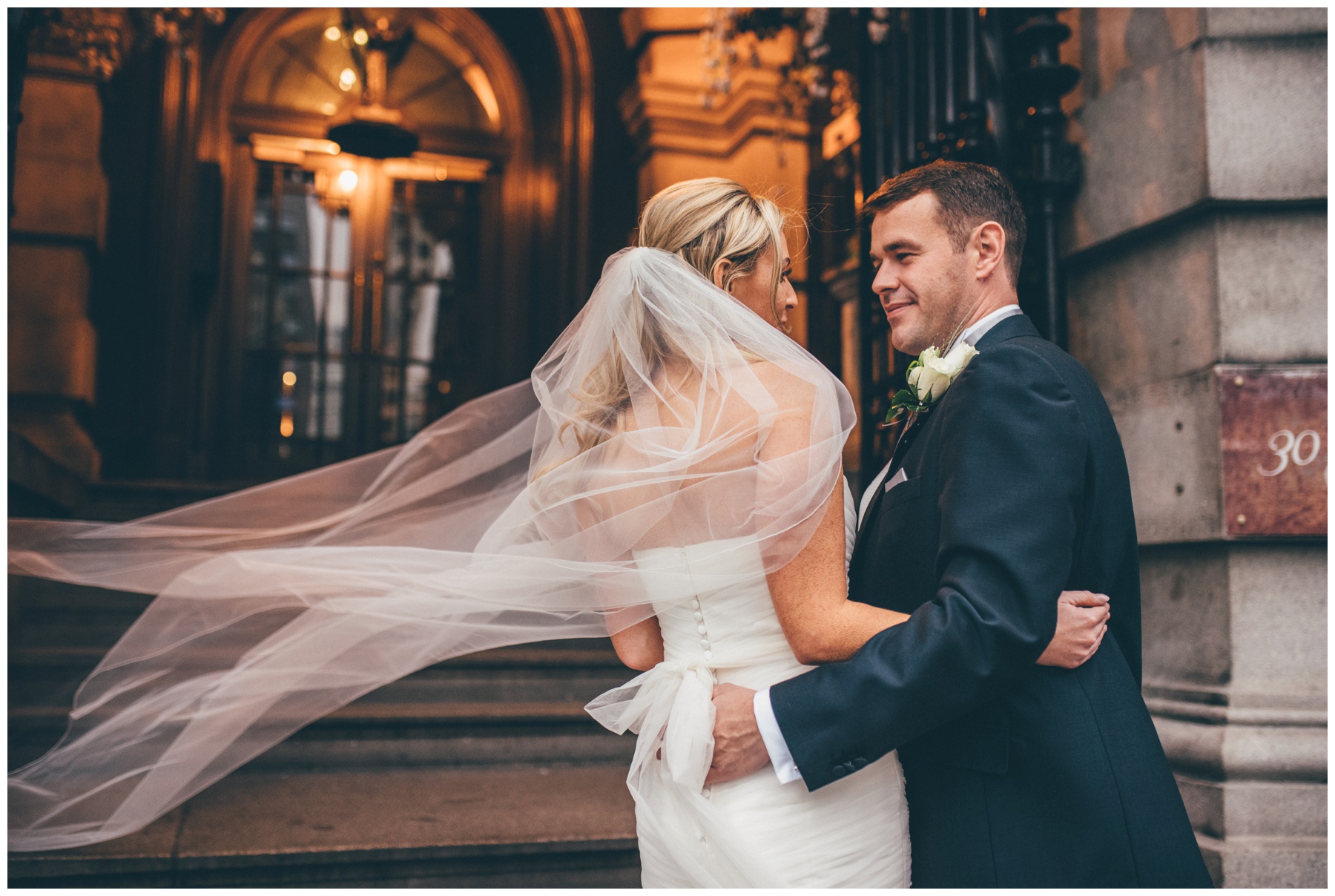 Bride and groom embrace at the front of their Liverpool City Centre wedding, 30 James Street,