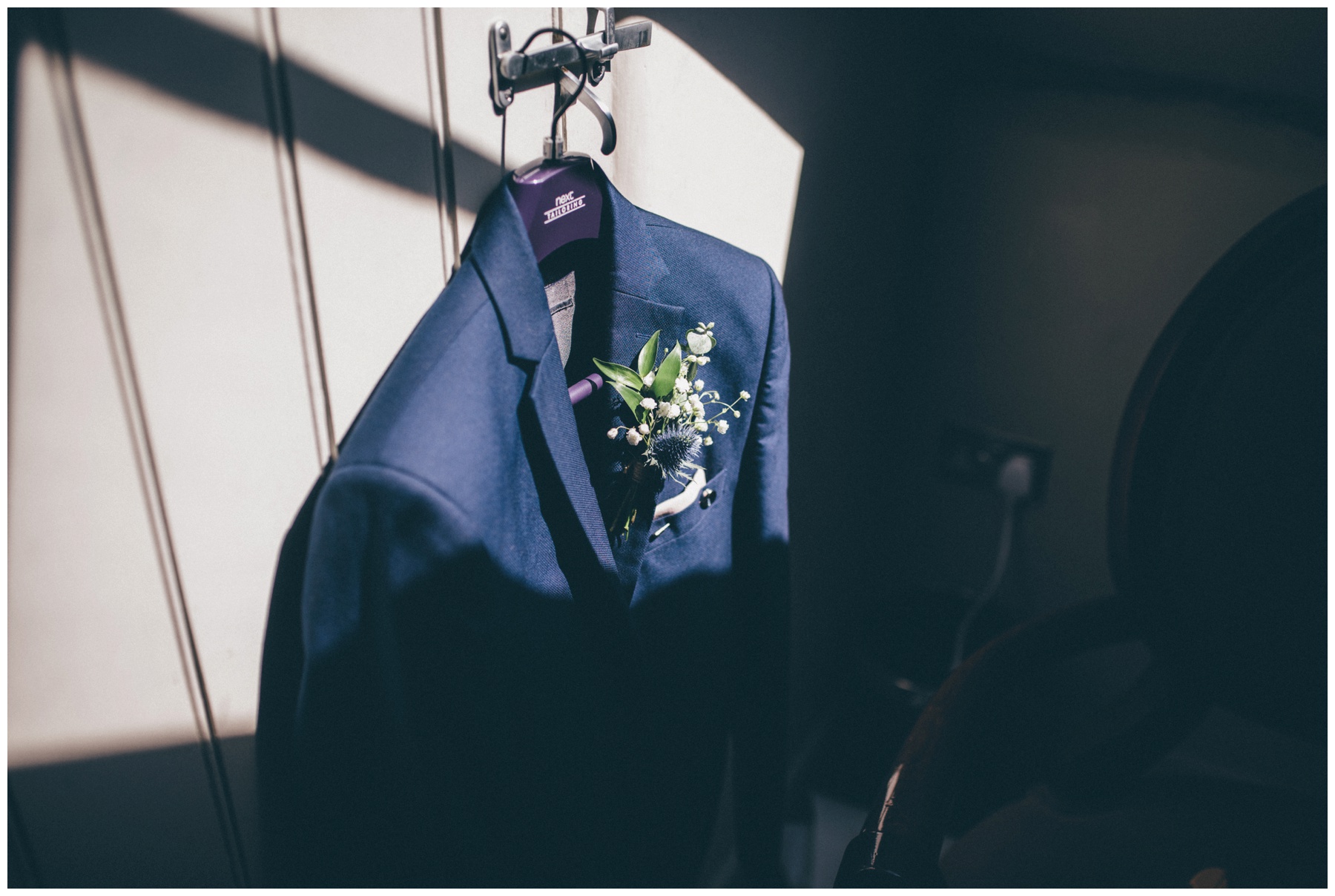 Grooms suit adorned with Thistle buttonhole at Oddfellows in Chester.