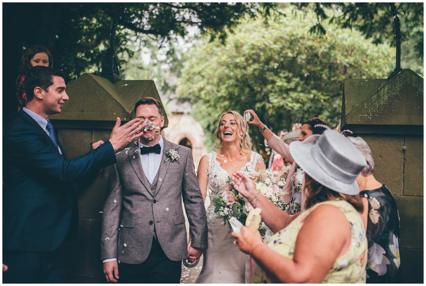 From gets confetti thrown in his face by one of the wedding guests at Staffordshire tipi wedding.
